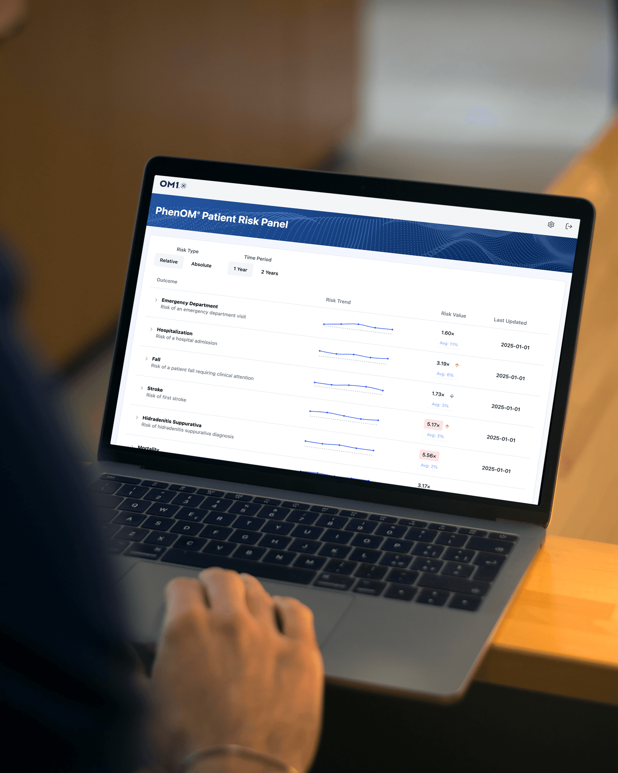 an open laptop showing the phenOM dashboard of a patient risk panel